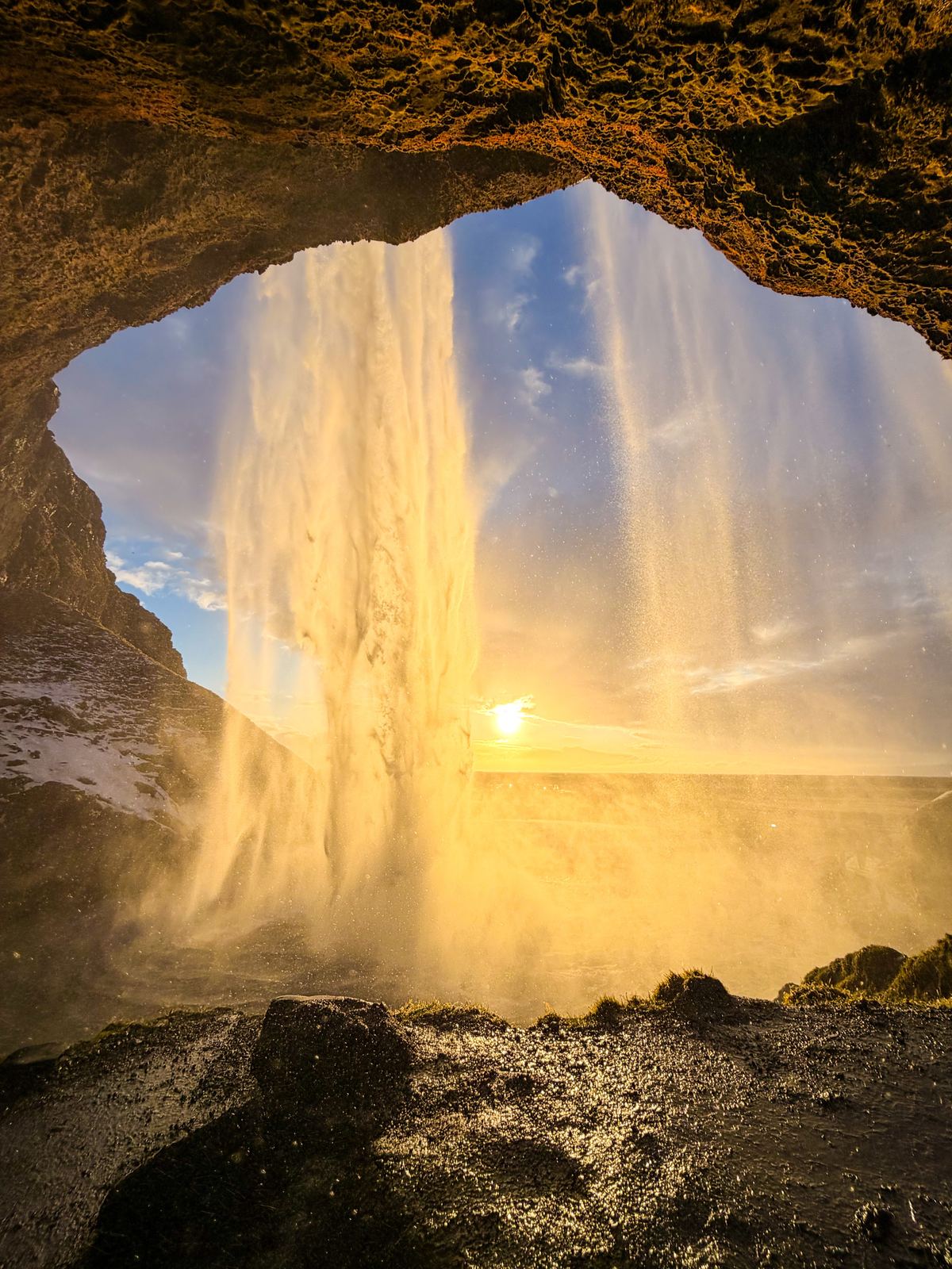 Behind Seljalandsfoss at sunset